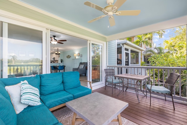 sunroom featuring ceiling fan