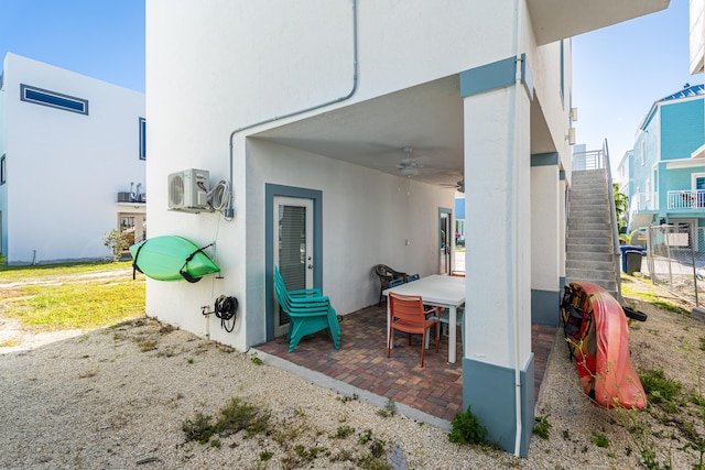 exterior space featuring ceiling fan