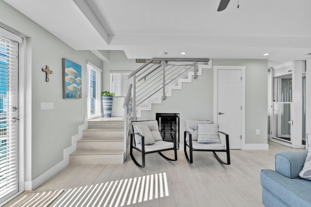 interior space with ceiling fan and wood-type flooring