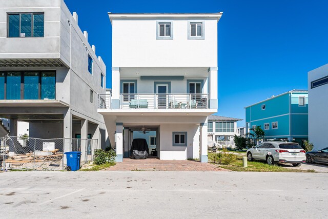 view of front of property featuring a balcony