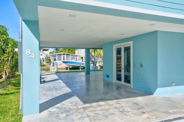 84 Coral Way -, Unit Key Largo, FL 33037 - view of patio with french doors and a carport