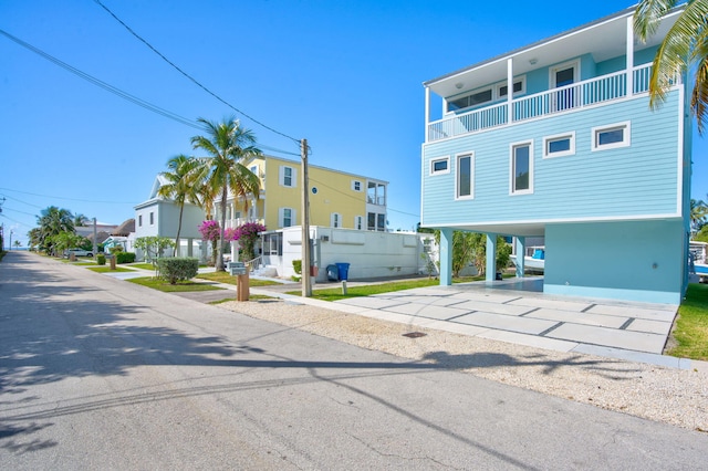 84 Coral Way -, Unit Key Largo, FL 33037 - view of front facade featuring a carport and concrete driveway