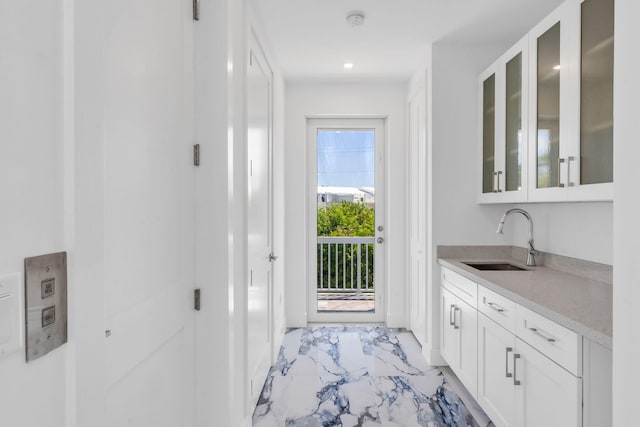 84 Coral Way -, Unit Key Largo, FL 33037 - bar area featuring a sink and light marble finish floors