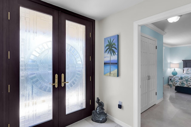 101 E Ocean Dr Unit C402, Key Colony, FL 33051 - foyer entrance featuring french doors, baseboards, and crown molding