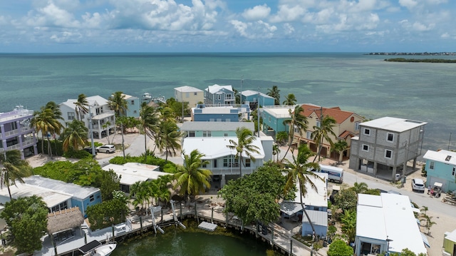 bird's eye view featuring a water view and a residential view