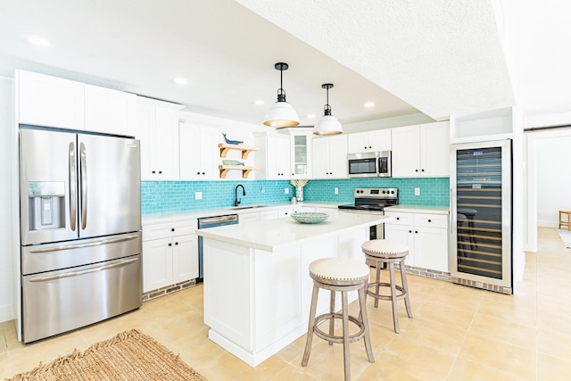 kitchen featuring white cabinetry, appliances with stainless steel finishes, and sink