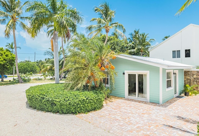 view of side of home featuring a patio