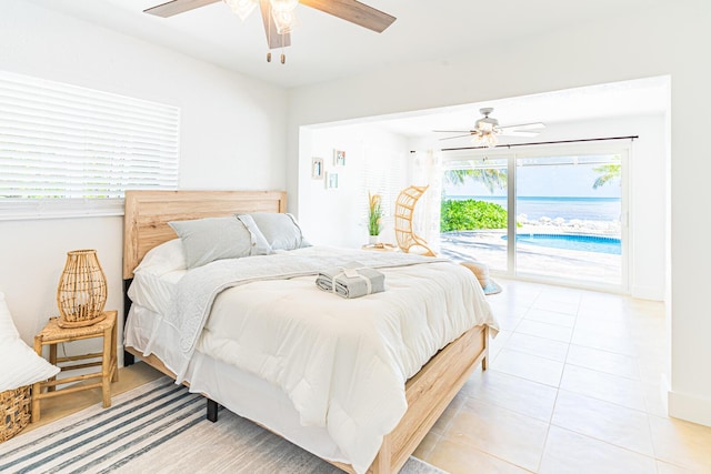 tiled bedroom featuring ceiling fan and access to exterior