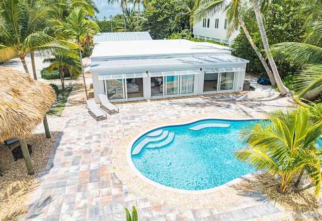 view of swimming pool with a patio area