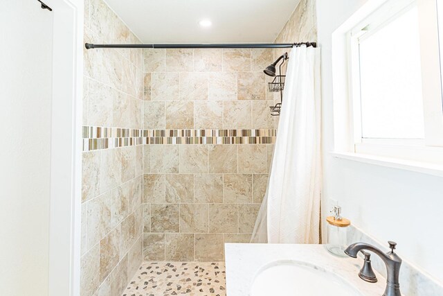 bathroom with sink and a shower with curtain