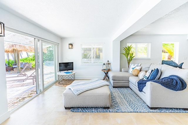 tiled living room with a textured ceiling