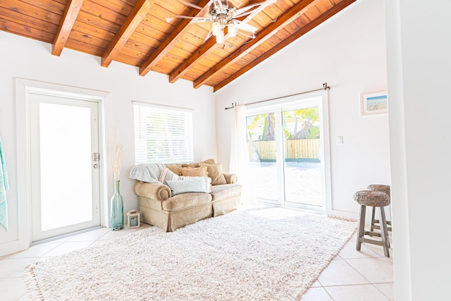 tiled living room with ceiling fan, wooden ceiling, and vaulted ceiling with beams