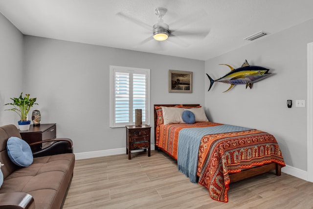 bedroom featuring light hardwood / wood-style flooring and ceiling fan