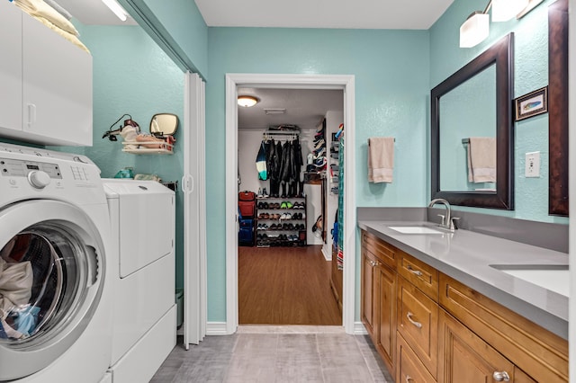 washroom featuring sink and washer and dryer