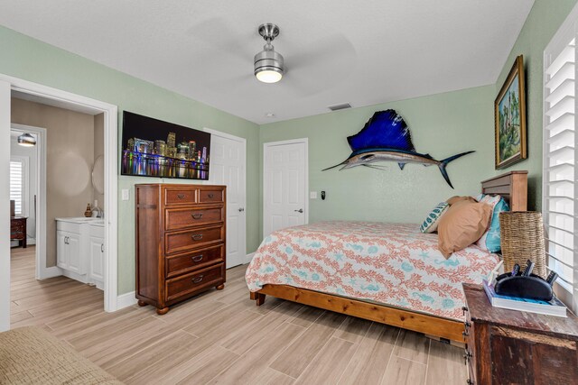 bedroom with ceiling fan and light wood-type flooring