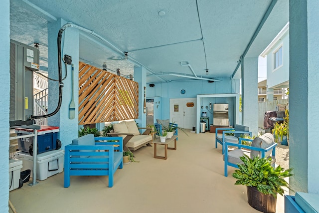 view of patio / terrace with an outdoor living space and ceiling fan