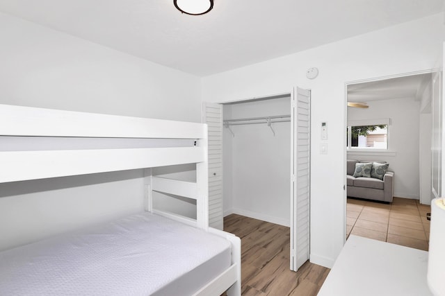 bedroom featuring light wood-type flooring and a closet