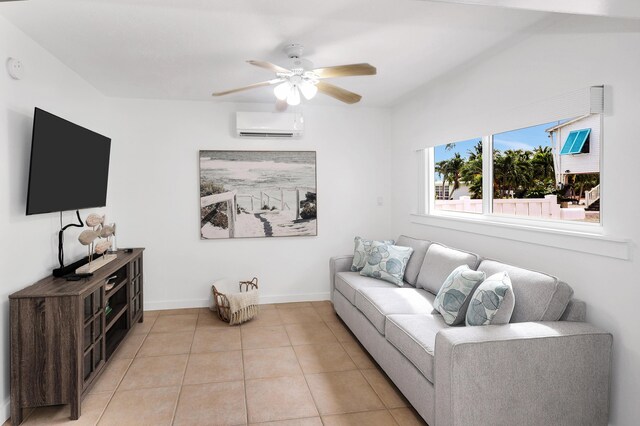 tiled living room with a wall unit AC and ceiling fan