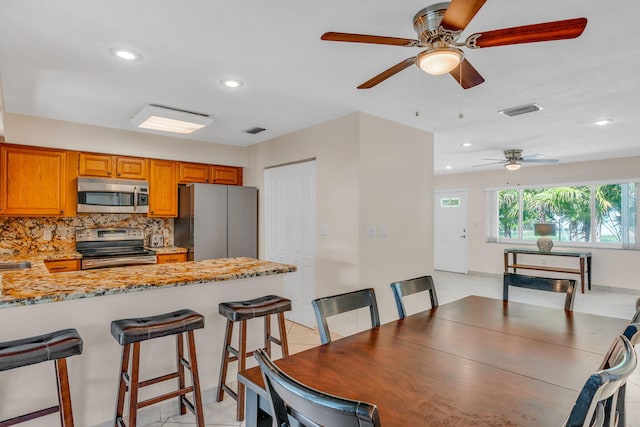 dining room featuring light tile patterned floors