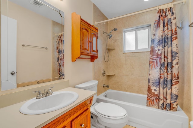 full bathroom featuring vanity, shower / bath combination with curtain, and toilet