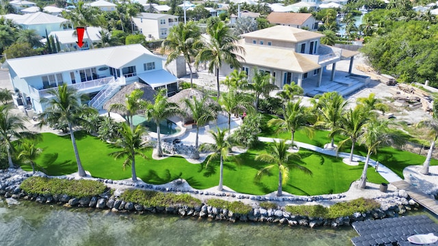 bird's eye view with a water view and a residential view