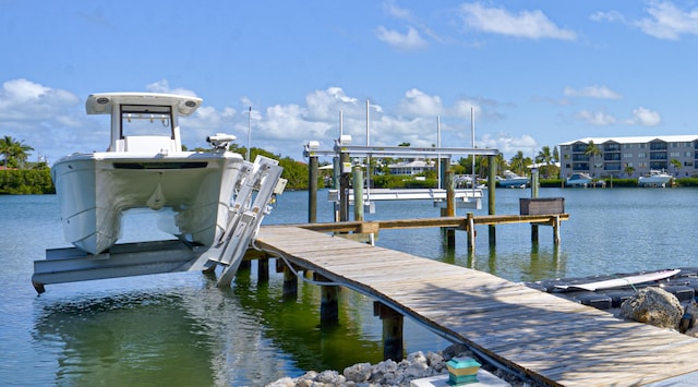 view of dock featuring a water view and boat lift