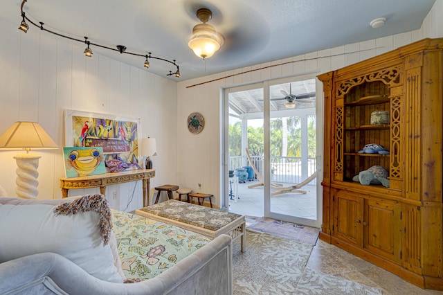 bedroom featuring access to outside and track lighting