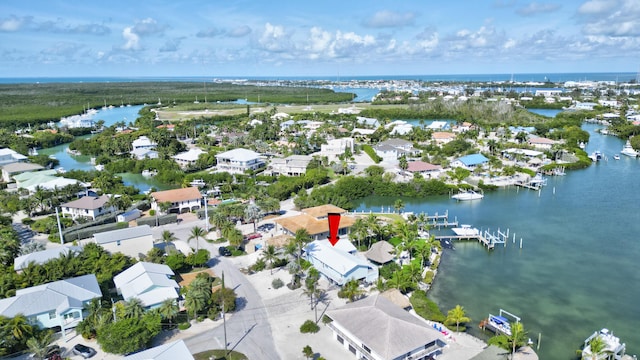 aerial view featuring a water view and a residential view