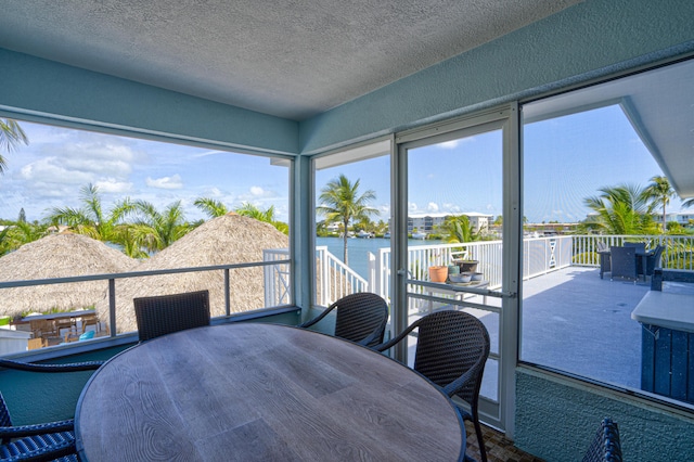 sunroom with a water view