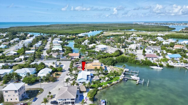 aerial view with a water view and a residential view