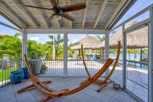 exterior space with ceiling fan, a water and mountain view, and a gazebo