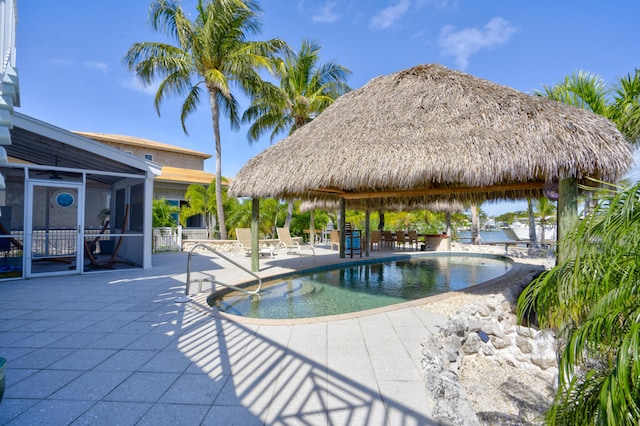 pool featuring a gazebo, a patio, and a lanai