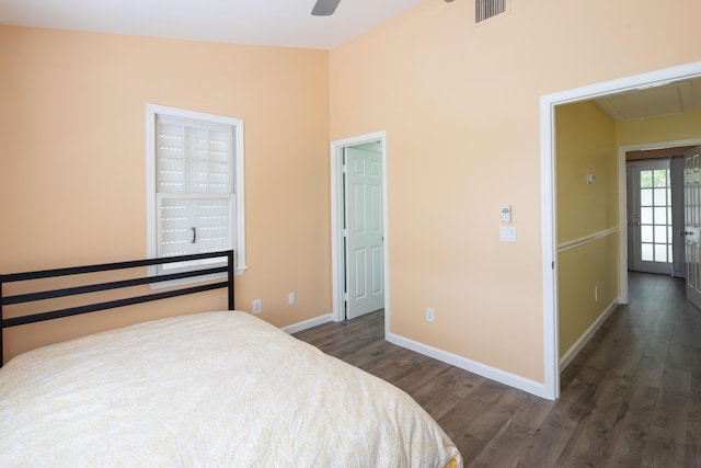 bedroom with vaulted ceiling, ceiling fan, and dark hardwood / wood-style flooring