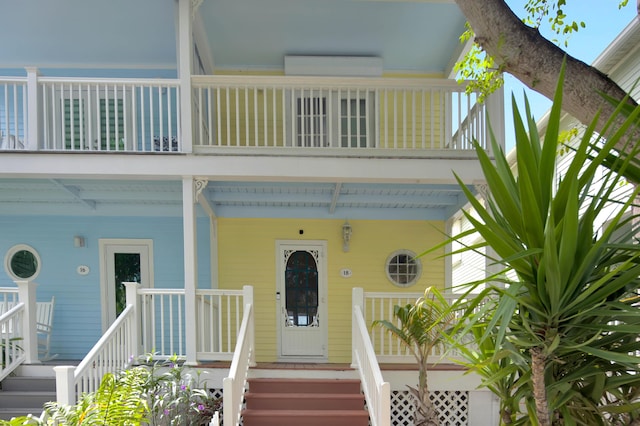 property entrance featuring covered porch