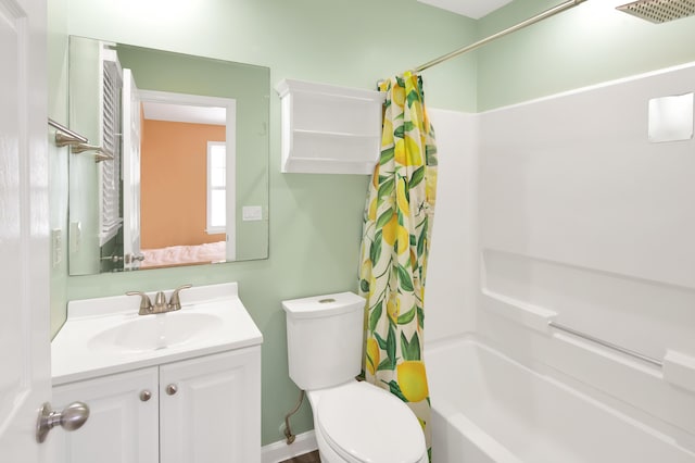 full bathroom with shower / tub combo with curtain, vanity, and toilet