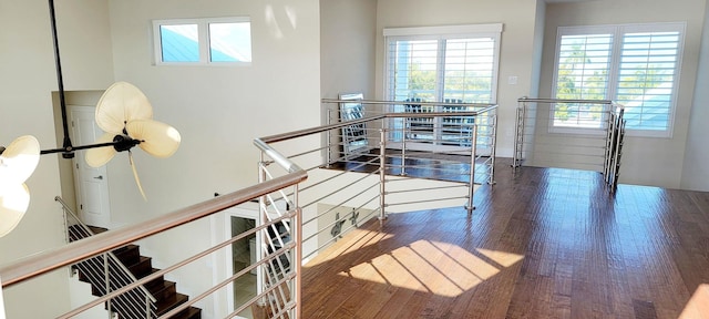 stairway featuring wood finished floors
