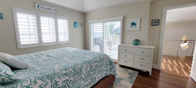 bedroom with dark wood-style floors