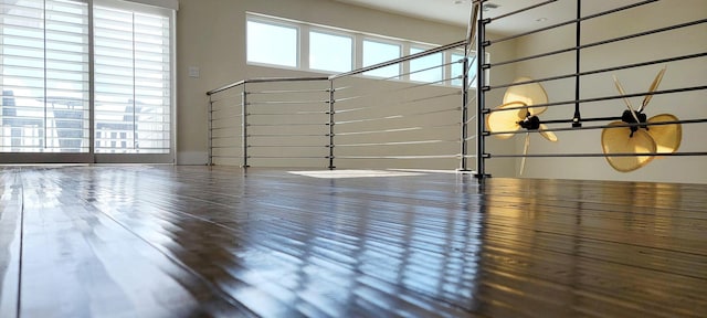 interior space featuring wood finished floors and a healthy amount of sunlight