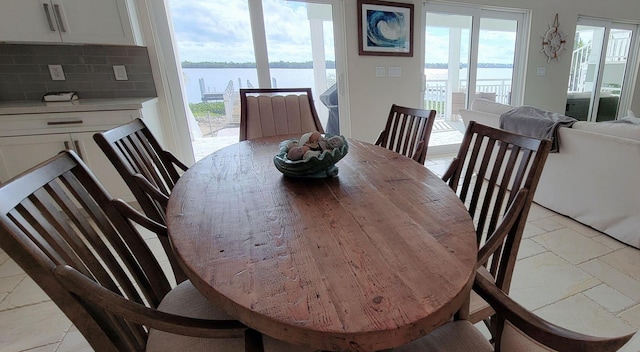 dining space with a water view