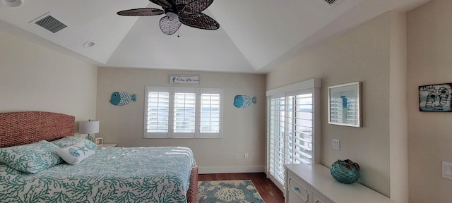 bedroom featuring dark wood-style flooring, visible vents, baseboards, ceiling fan, and lofted ceiling