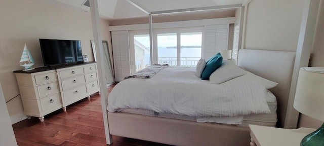 bedroom with dark wood-style floors