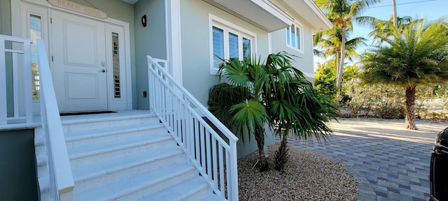 entrance to property with stucco siding