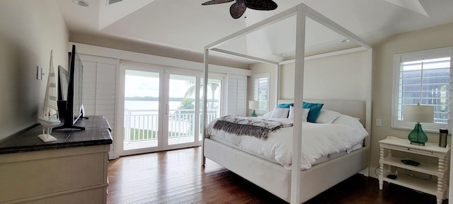 bedroom with dark wood-style floors, access to exterior, and visible vents