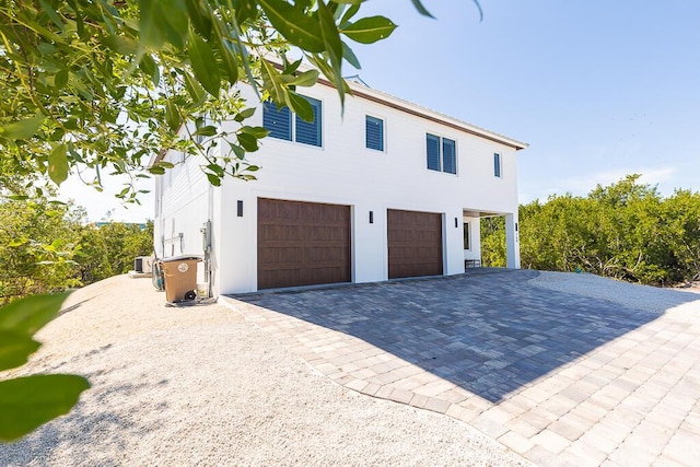 view of property exterior with a garage