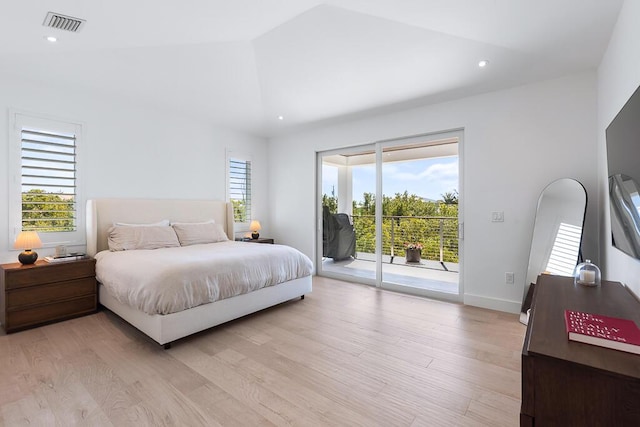 bedroom featuring high vaulted ceiling, access to outside, and light wood-type flooring