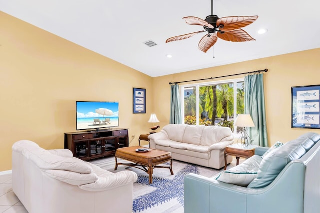 living room featuring ceiling fan, lofted ceiling, and light tile patterned floors