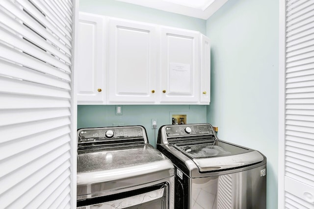 laundry room with cabinets and separate washer and dryer