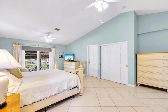 tiled bedroom with vaulted ceiling and ceiling fan