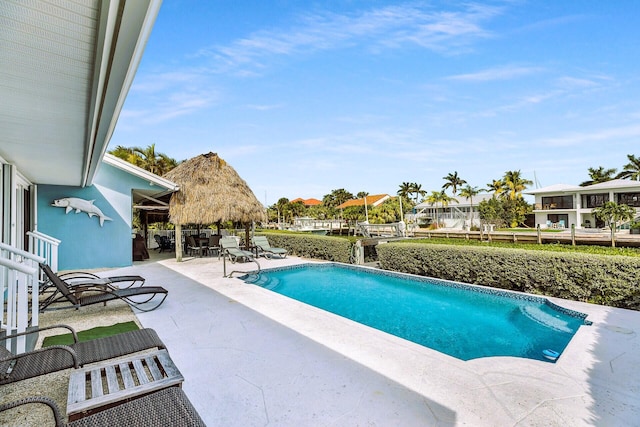 view of swimming pool featuring a patio area