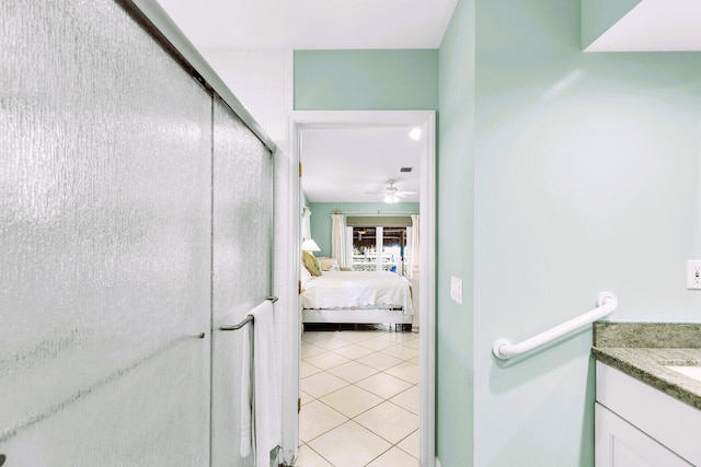 hall featuring light tile patterned flooring